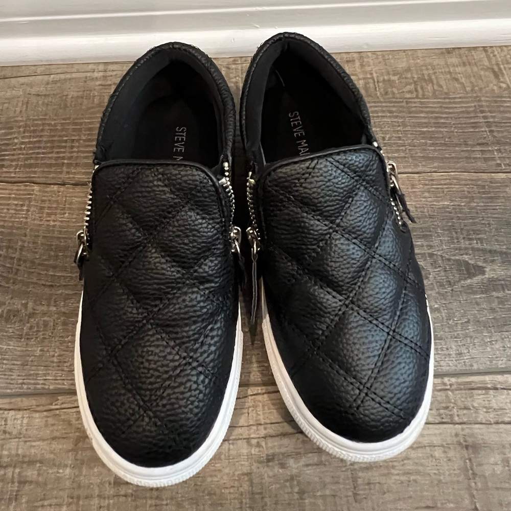 Girls black slip on flat sneakers